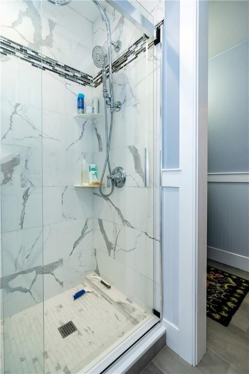 bathroom with a shower with shower door