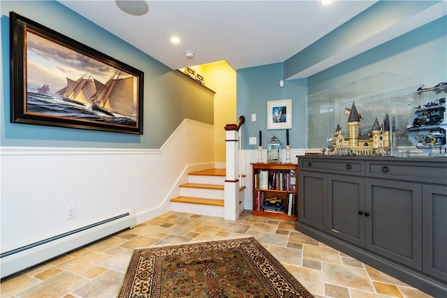 hallway featuring a baseboard heating unit