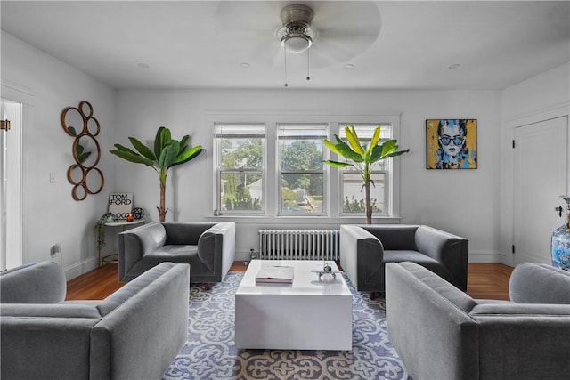 living room featuring ceiling fan and radiator heating unit