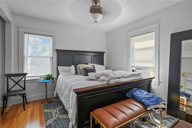 bedroom featuring hardwood / wood-style floors and ceiling fan