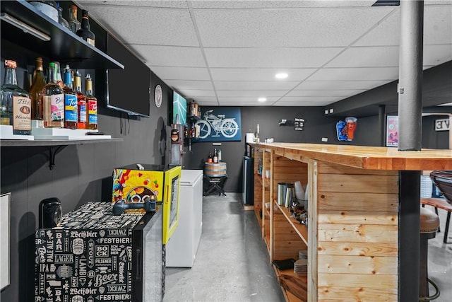 bar featuring a paneled ceiling