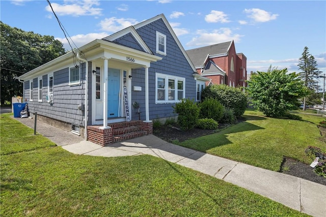 bungalow featuring a front yard