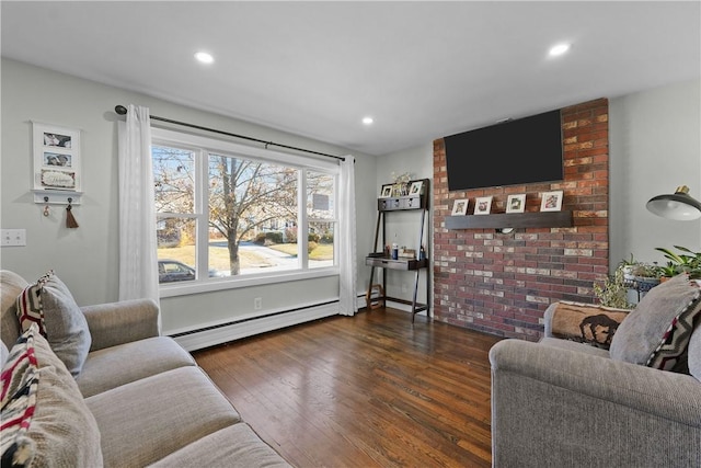 living room featuring baseboard heating and dark wood-type flooring