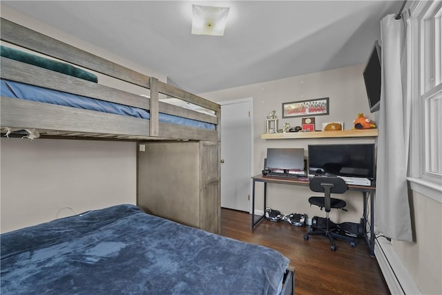 bedroom featuring dark wood-type flooring and a baseboard radiator