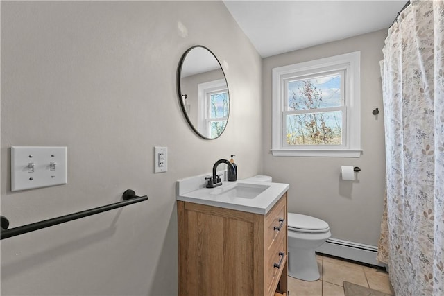 bathroom featuring tile patterned floors, vanity, toilet, and a baseboard heating unit