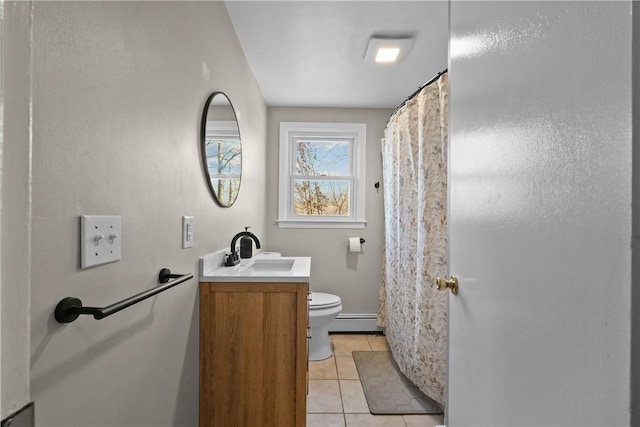 bathroom featuring tile patterned floors, vanity, toilet, and a baseboard radiator