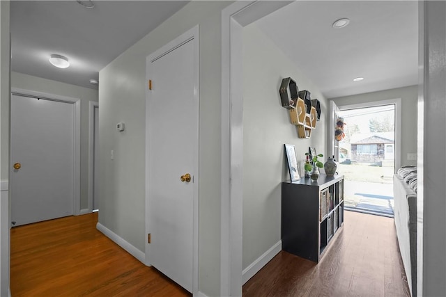 hall with dark hardwood / wood-style floors