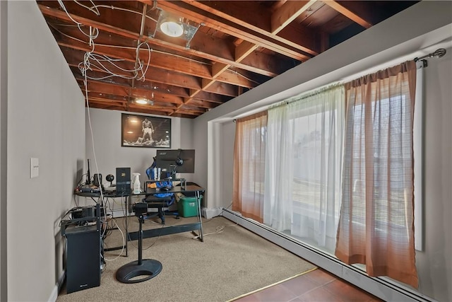 interior space featuring carpet floors and a baseboard heating unit