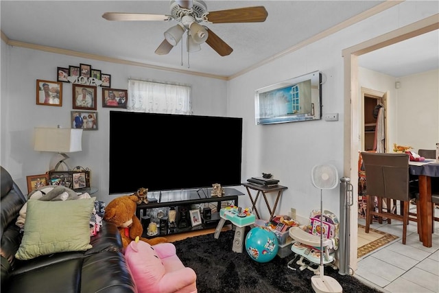 tiled living room featuring ceiling fan and ornamental molding