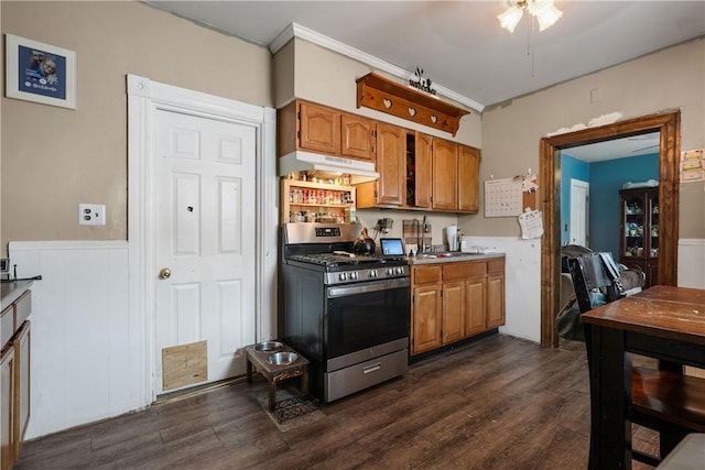 kitchen featuring ceiling fan, gas stove, and dark wood-type flooring