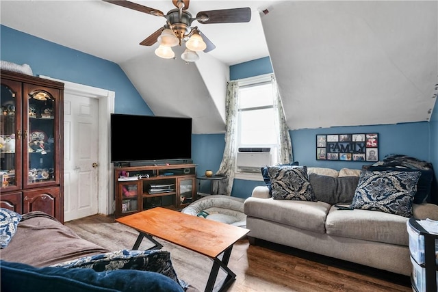 living room with ceiling fan, cooling unit, lofted ceiling, and light hardwood / wood-style flooring