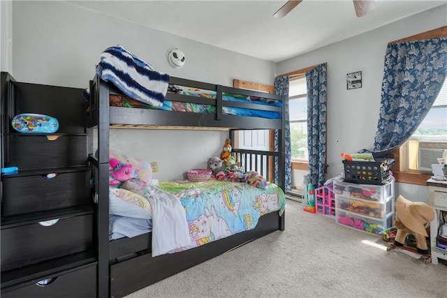 carpeted bedroom with multiple windows and ceiling fan