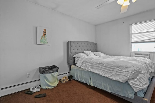 bedroom with ceiling fan, dark carpet, and a baseboard heating unit