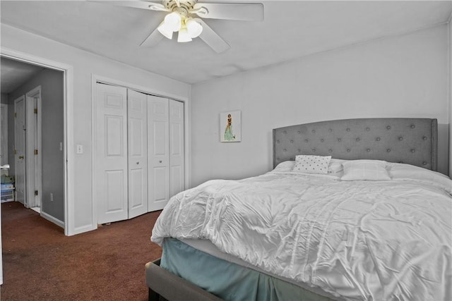 bedroom with a closet, dark carpet, and ceiling fan