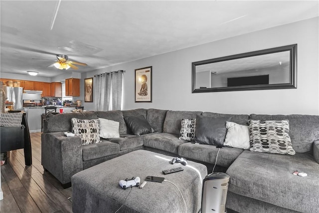 living room featuring dark hardwood / wood-style floors and ceiling fan