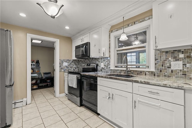 kitchen featuring backsplash, light stone counters, sink, black appliances, and white cabinets