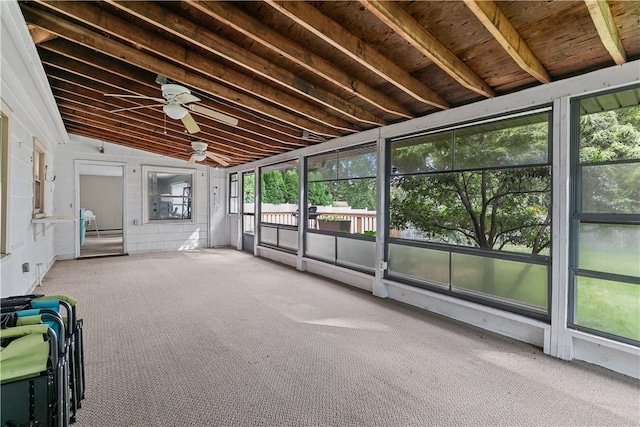 unfurnished sunroom with ceiling fan and lofted ceiling