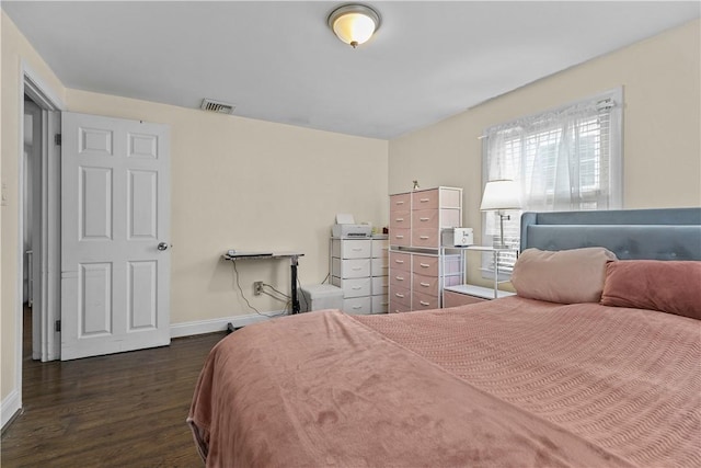 bedroom featuring dark hardwood / wood-style floors