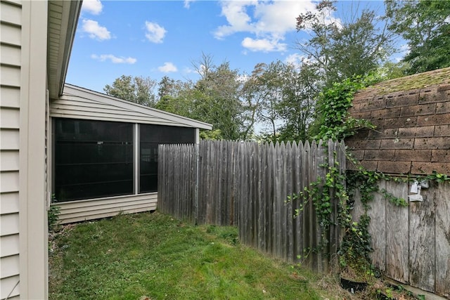 view of yard featuring a sunroom