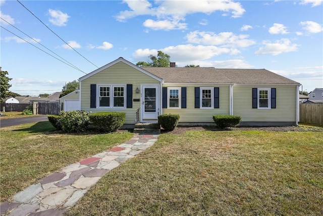 single story home featuring a front yard and a garage