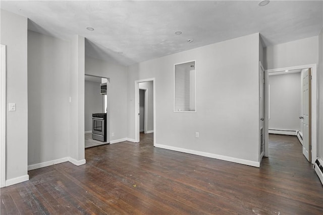 unfurnished living room with dark hardwood / wood-style floors and a baseboard radiator