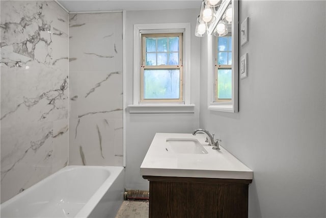 bathroom with vanity and tiled shower / bath combo