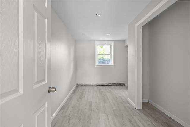 unfurnished room with light hardwood / wood-style flooring