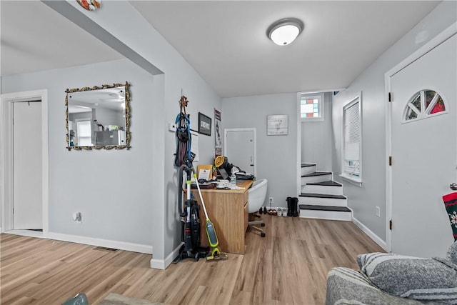 office space with light hardwood / wood-style flooring