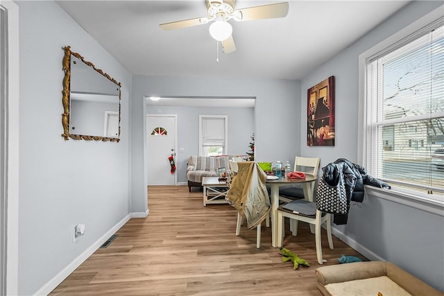 dining space featuring light hardwood / wood-style floors, a wealth of natural light, and ceiling fan