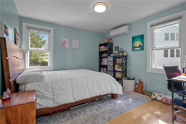 bedroom featuring an AC wall unit