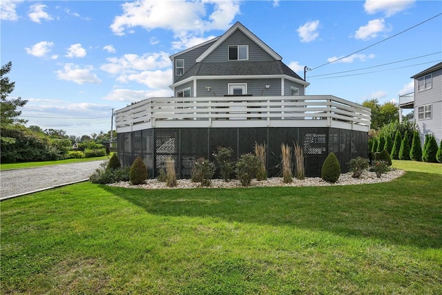 back of house with a yard and a wooden deck