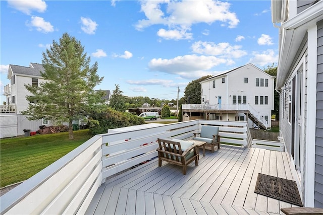 wooden terrace with a yard