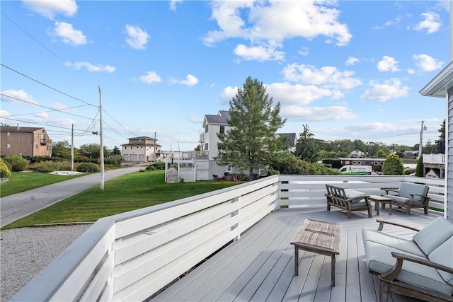 wooden terrace with a yard