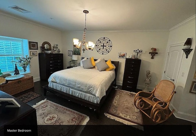 bedroom with dark hardwood / wood-style flooring, crown molding, and a notable chandelier