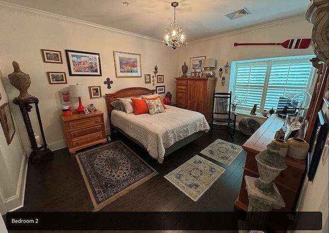 bedroom featuring dark hardwood / wood-style floors, crown molding, and a chandelier