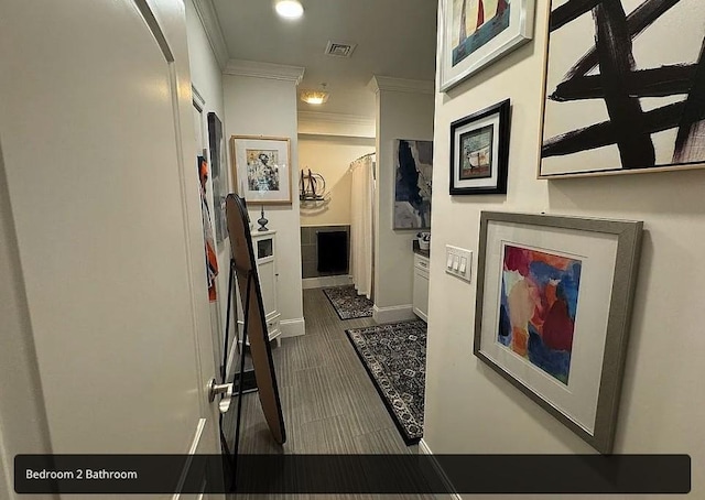 hallway featuring ornamental molding