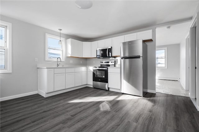 interior space featuring dark wood-type flooring, hookup for a washing machine, and hookup for an electric dryer