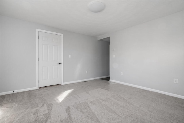 unfurnished bedroom with carpet flooring and multiple windows