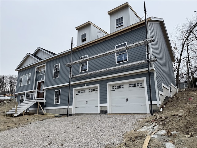 back of house with a garage