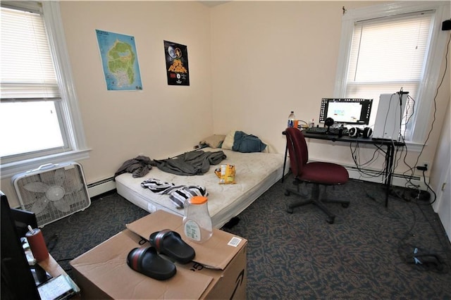 bedroom with a baseboard heating unit