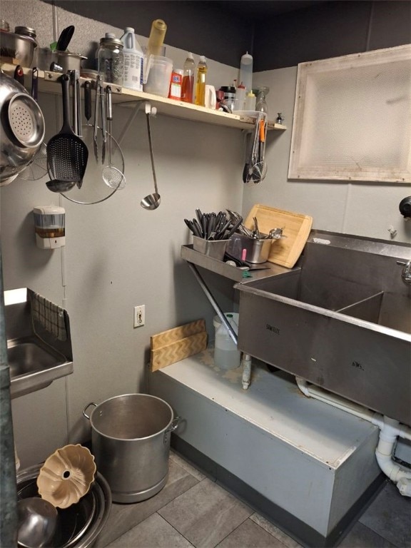 kitchen with sink and tile patterned flooring