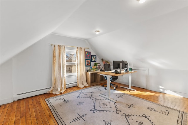 office area with baseboard heating, wood-type flooring, and lofted ceiling