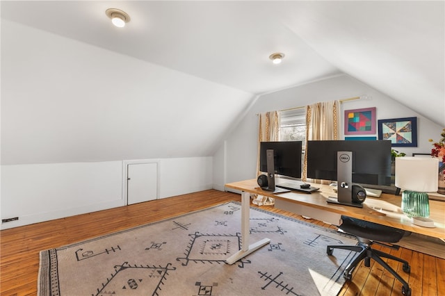 office area with wood-type flooring and vaulted ceiling