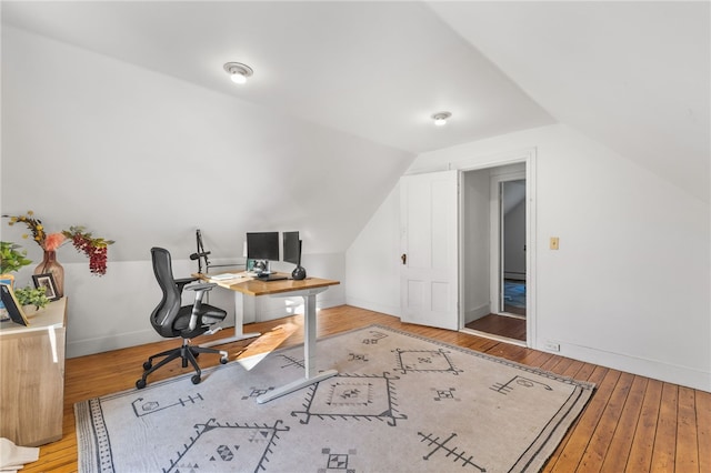 office space featuring hardwood / wood-style floors and lofted ceiling