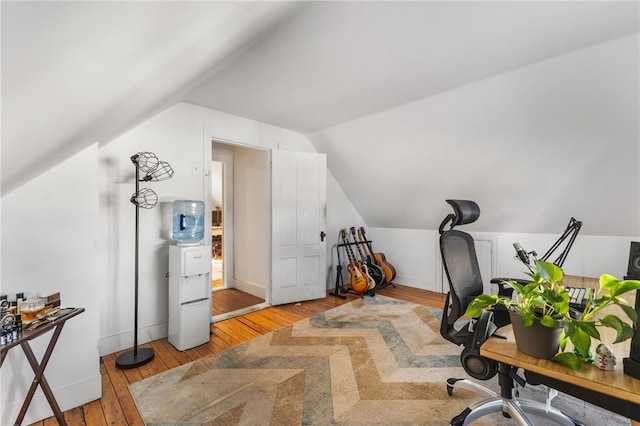 office featuring light hardwood / wood-style flooring and lofted ceiling