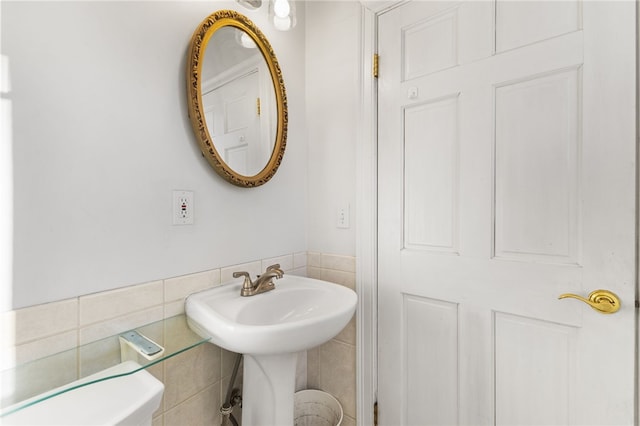 bathroom with tile walls