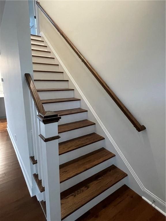 stairway with wood-type flooring