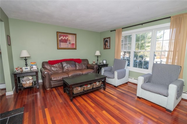 living room featuring plenty of natural light, dark hardwood / wood-style flooring, and baseboard heating