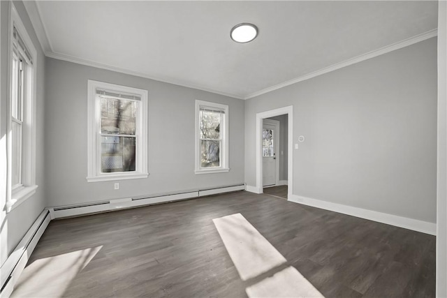 spare room with a baseboard radiator, dark hardwood / wood-style floors, and ornamental molding