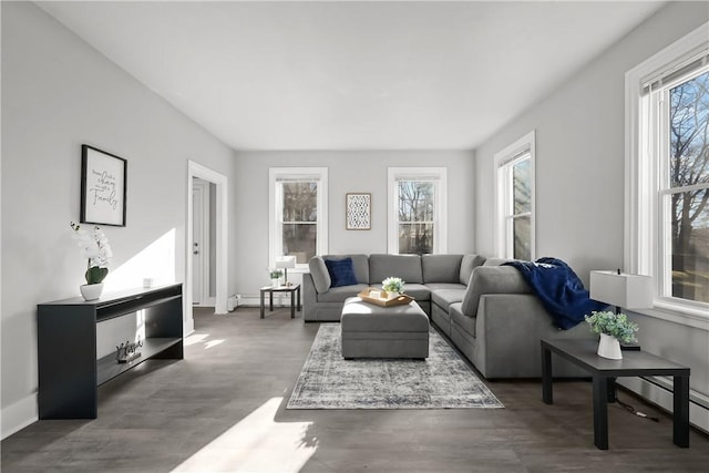 living room featuring dark wood-type flooring and a baseboard radiator